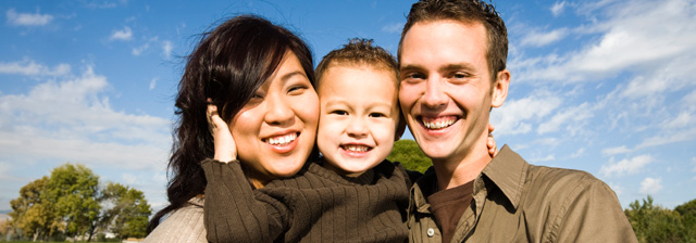 Happy family with mother, father and baby.